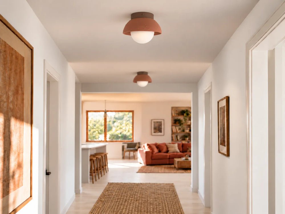 Two Karoo C lights on a hallway ceiling