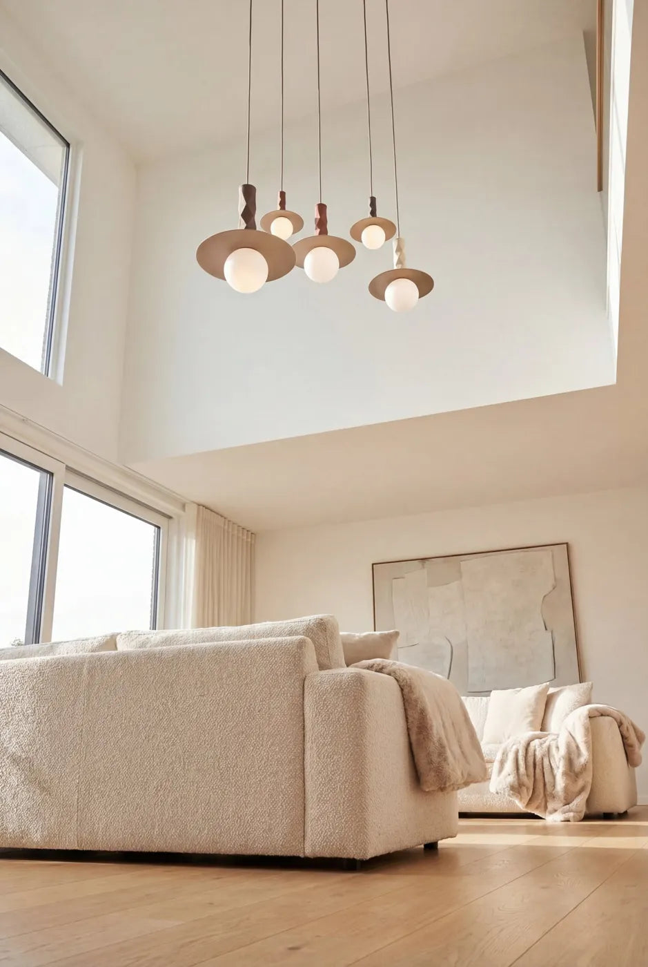 A cluster of Sono pendants in a double-height living room